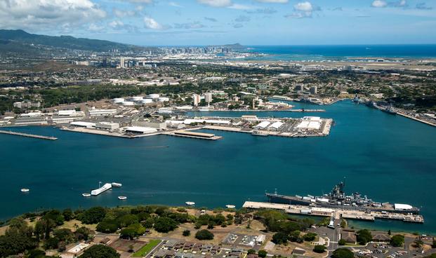 An aerial view of the USS Arizona and USS Missouri Memorials at Ford Island, Joint Base Pearl Harbor-Hickam.
