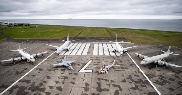 An aerial photo of the Naval Air Station (NAS) Whidbey Island flight line in Oak Harbor, Washington, taken April 30, 2021, from a U.S. Navy MH-60S Seahawk assigned to the air station's Search and Rescue (SAR) Unit.