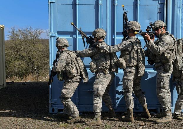 Students of the 435th Security Forces Squadron’s Ground Combat Readiness Training Center’s Security Operations Course prepare to tactically search a building during the urban operations portion of the course on U.S. Army Garrison Baumholder, Germany, April 4, 2017.