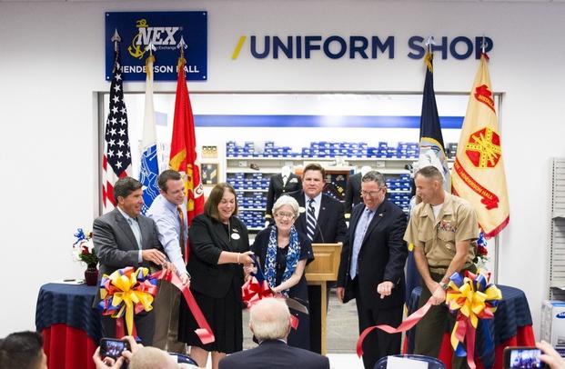 Photo of the ribbon cutting for the grand opening of the MCX third floor addition and NEX Uniform Center at Henderson Hall.
