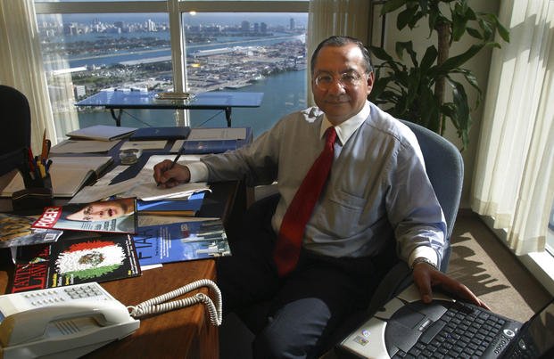 Manuel Rocha sits in his office at Steel Hector & Davis in Miami