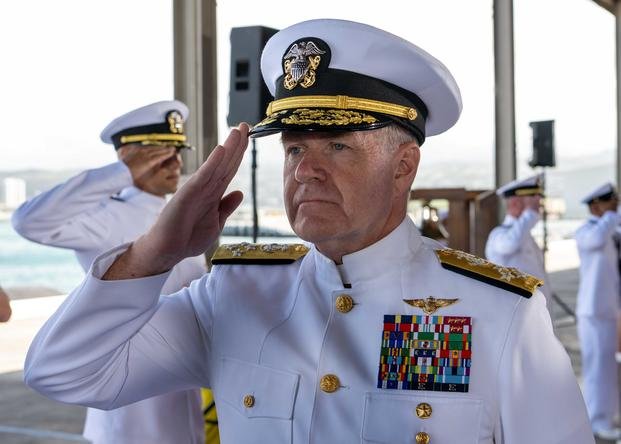 Adm. Samuel Paparo, commander, U.S. Pacific Fleet, salutes sideboys during the COMPACFLT change of command ceremony onboard Joint Base Pearl Harbor-Hickam.