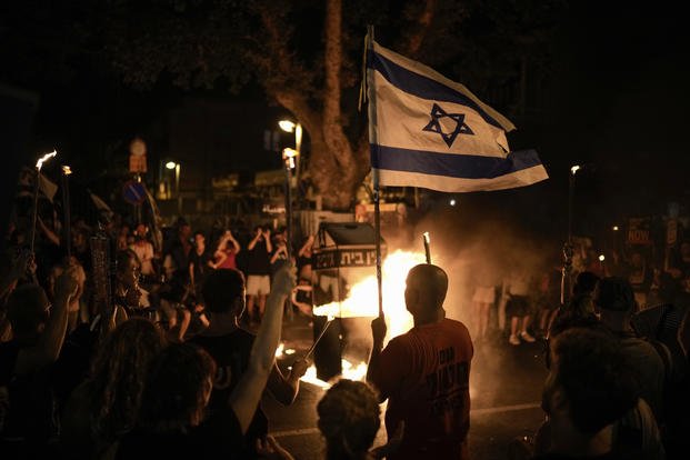 People protest against Israeli Prime Minister Benjamin Netanyahu's government.