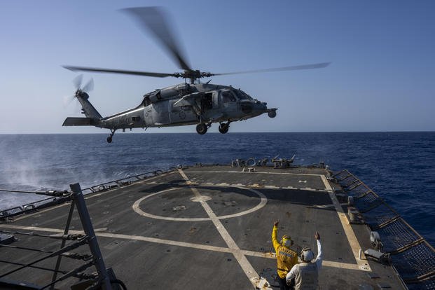 HSC-7 helicopter lands on the Arleigh Burke-class guided missile destroyer USS Laboon in the Red Sea