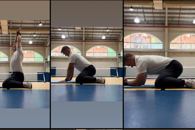 Military.com fitness columnist Stew Smith demonstrates the 3-step variation of the 'frog pose' in yoga. 