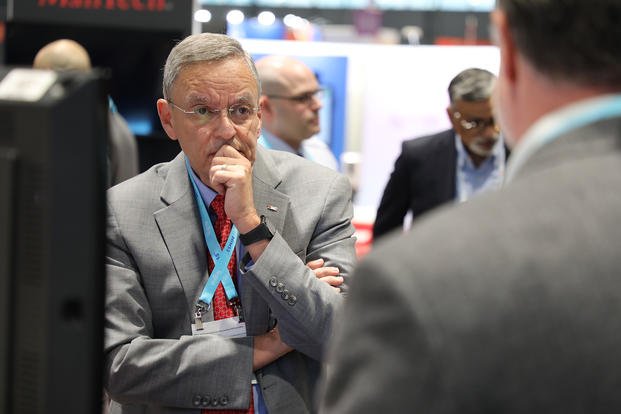 Dr. Lester Martinez-Lopez, assistant secretary of defense for health affairs, tours the Federal Health Pavilion at the HIMSS Conference in Chicago.