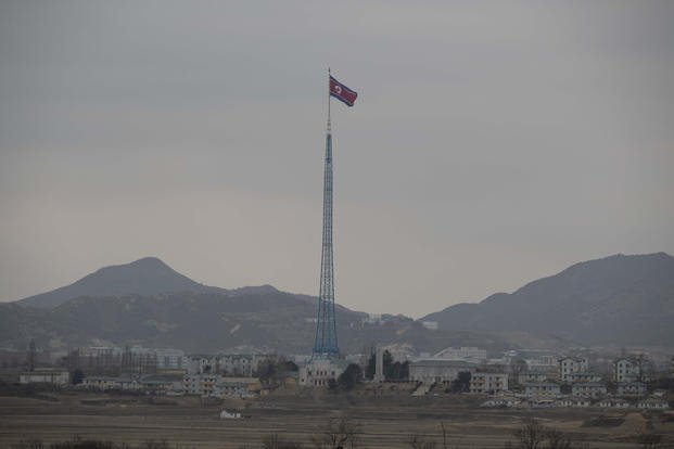 A North Korean flag flutters in the wind. 