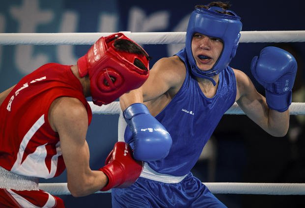 Maksym Halinichev of Ukraine competes against Abdumalik Khalokov