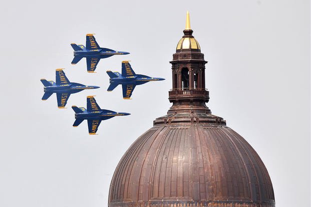 Jets fly past the Naval Academy Chapel dome. 