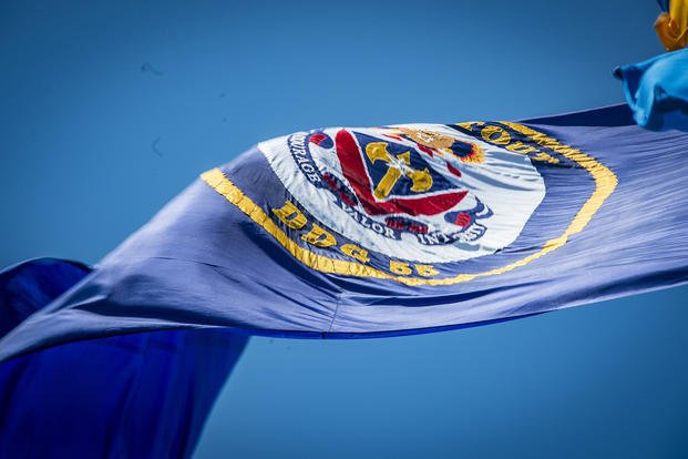 The flag of the Arleigh-Burke class, guided-missile destroyer USS Stout (DDG 55) flies in the wind.