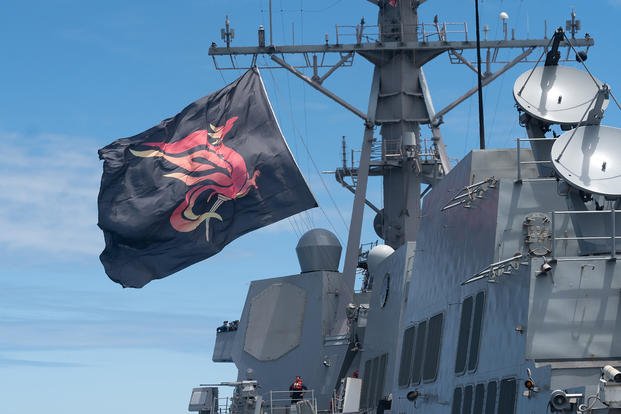 The Arleigh Burke-class, guided-missile destroyer USS Sterett (DDG 104) fly their battle flag after conducting a replenishment-at-sea with German Navy replenishment ship FGS Frankfurt Am Main (A 1412) during Exercise Rim of the Pacific (RIMPAC) 2024. 