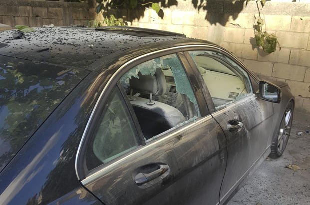 Partly damaged car after a walkie-talkie explosion in Sidon, Lebanon