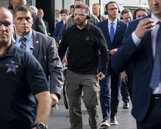 Ukrainian President Volodymyr Zelenskyy, center, tours the Scranton Army Ammunition Plant