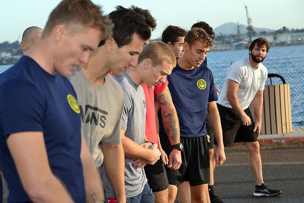 Twenty-five future sailors line up before a timed 1.5-mile run as the Navy Talent Acquisition Group (NTAG) Southwest Naval Special Warfare/Naval Special Operations team administers a physical screening test (PST) at Naval Amphibious Base Coronado.