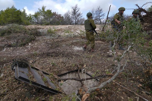 Israeli soldiers stand in southern Lebanon, near the border with Israel.