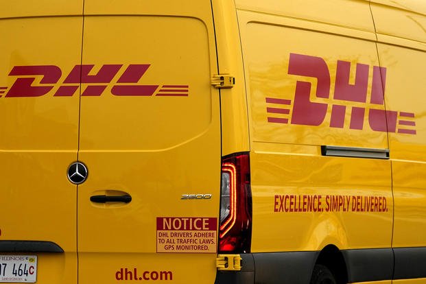 DHL logos are seen on the back of a company truck in Glenview, Ill.