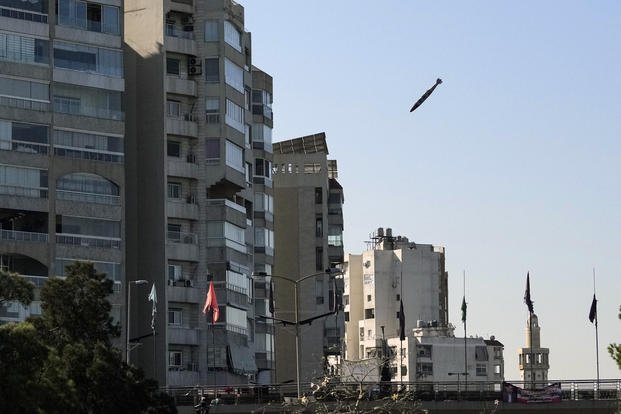 Bomb dropped from an Israeli jet prepares to hit a building in Tayouneh, Beirut