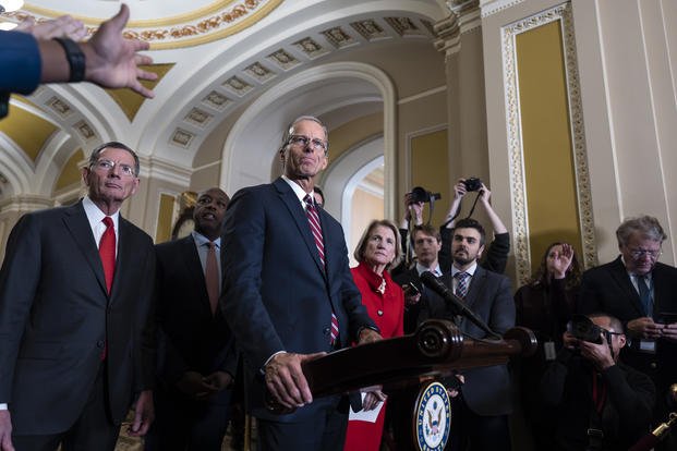 Senate Minority Whip John Thune, R-S.D., joined at left by Sen. John Barrasso, R-Wyo.