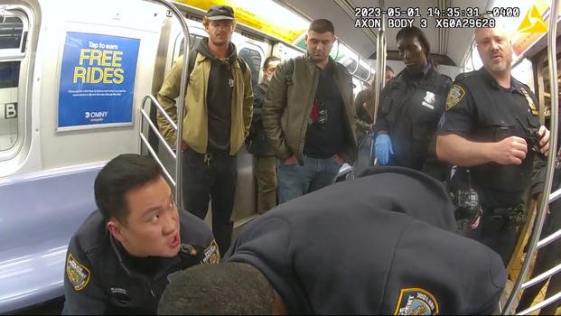 Daniel Penny looks on as NYC police officers attempt to revive Jordan Neely 