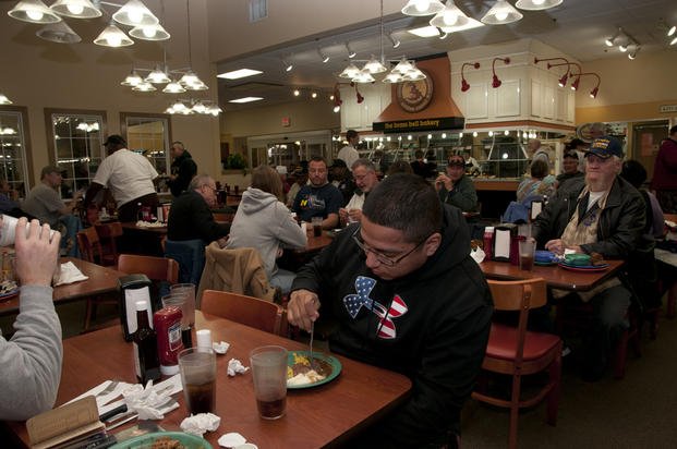 Veterans enjoy a free meal at Golden Corral, in Fort Wayne, Ind., on Veteran's Day, Nov. 9, 2013. 