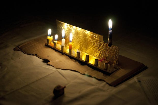 A menorah is lit to commemorate Hanukkah at the Forward Operating Base Lagman chapel in Zabul province, Afghanistan.