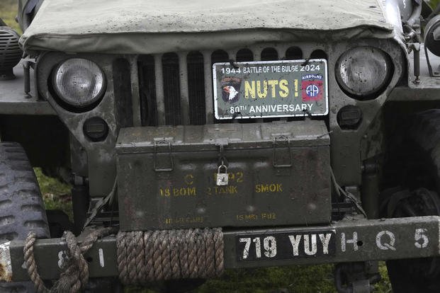 A vintage American jeep is parked during the 80th commemoration of the Battle of the Bulge in Bastogne, Belgium.