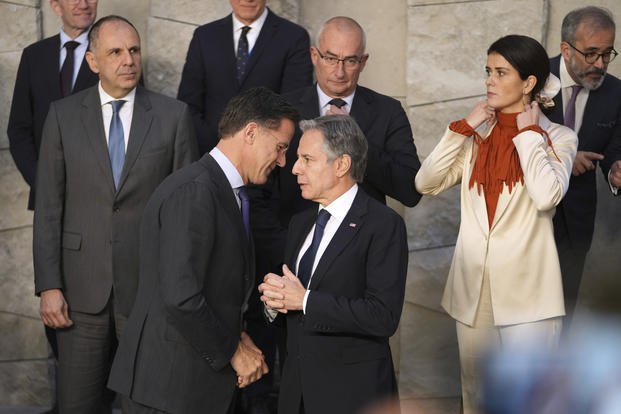 United States Secretary of State Antony Blinken, front center, speaks with NATO Secretary General Mark Rutte