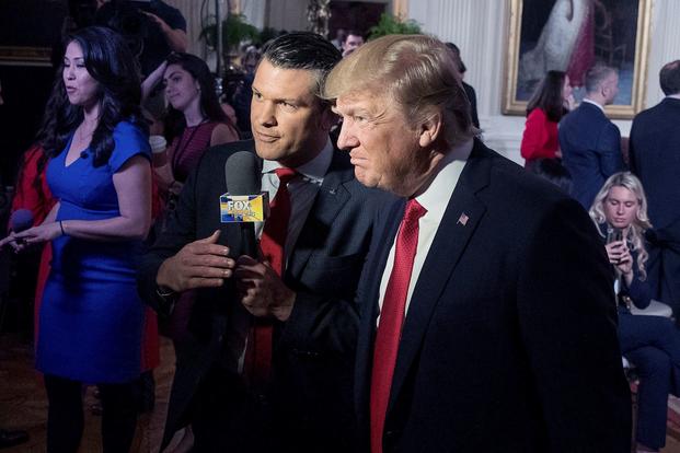 President Donald Trump, right, appears on "Fox & Friends" with co-host Pete Hegseth