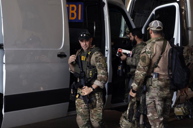 FBI personnel arrive at the Caesars Superdome ahead of the Sugar Bowl NCAA College Football Playoff game on Thursday, Jan. 2, 2025, in New Orleans.