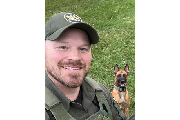 U.S. Border Patrol agent David Maland and his K9 partner, Cora