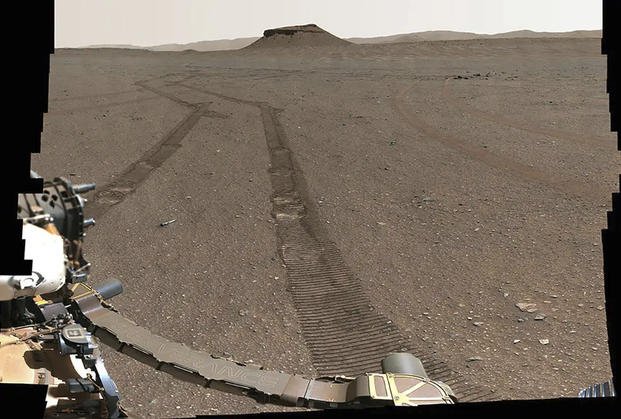 Perseverance rover capturing a portrait of its recently completed sample depot using its Mastcam-Z camera