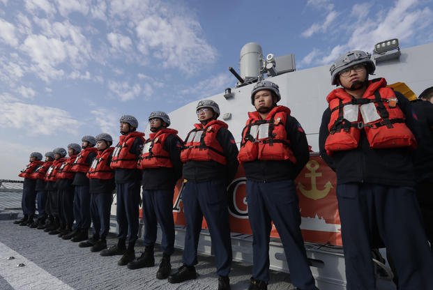 Deck crew of Taiwanese navy stand by on a Taiwan's domestically made Tuo Chiang patrol ship