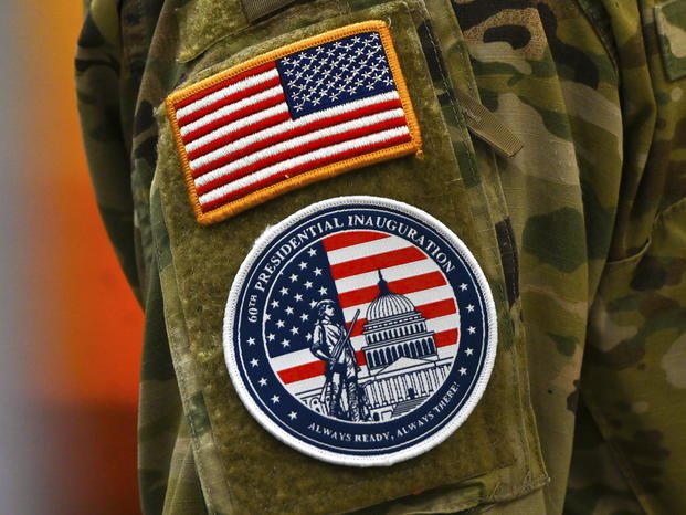 An Army National Guard soldier's arm shows uniform patches