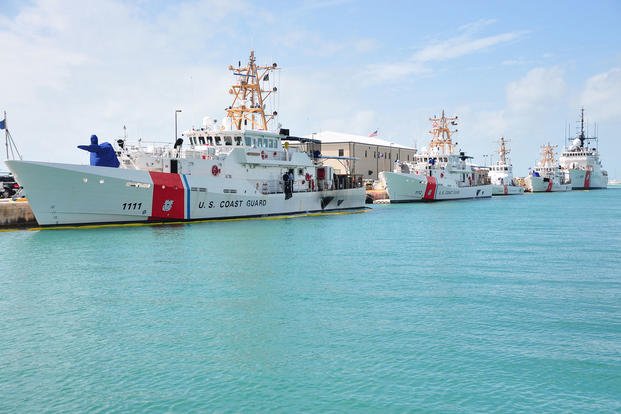 Coast Guard cutters are shown moored to the pier at Coast Guard Sector Key West, Florida