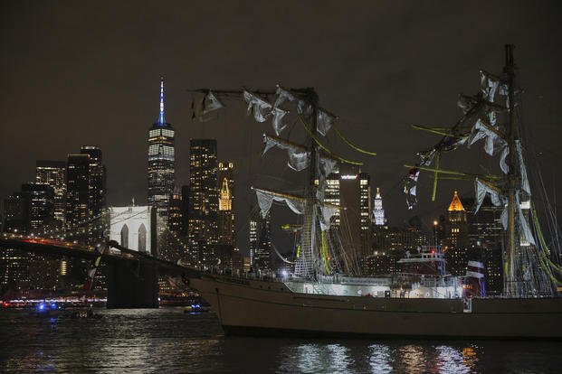 A masted Mexican Navy training ship, the Cuauhtémoc, sits stranded after colliding with the Brooklyn Bridge