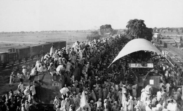 Muslim refugees crowd onto a train bound for Pakistan.