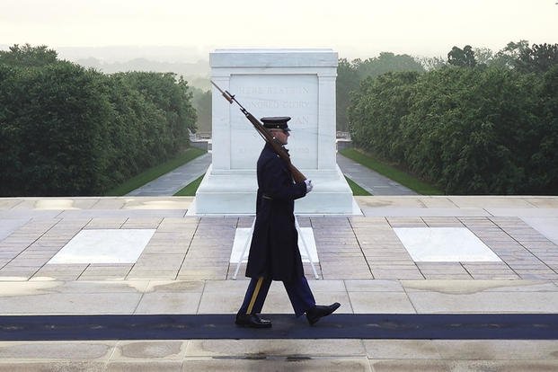 Army Sgt. 1st Class Andrew Jay patrols the Tomb of the Unknown Soldier at Arlington National Cemetery