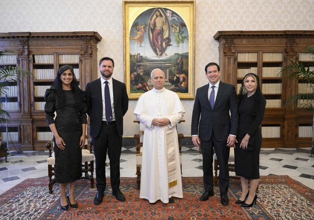 Pope Leo XIV stands for a family photo with Vice President JD Vance