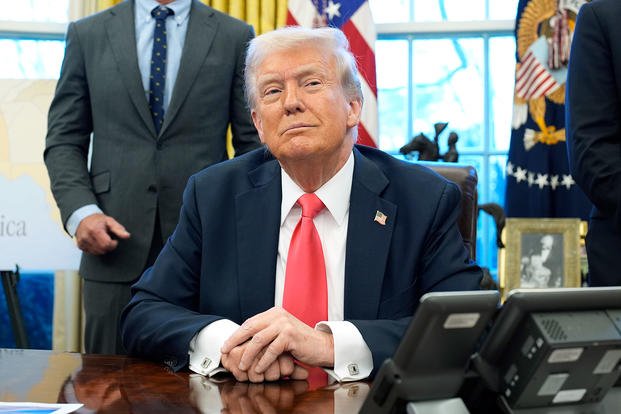 U.S. President Donald Trump speaks to reporters after signing executive orders in the Oval Office