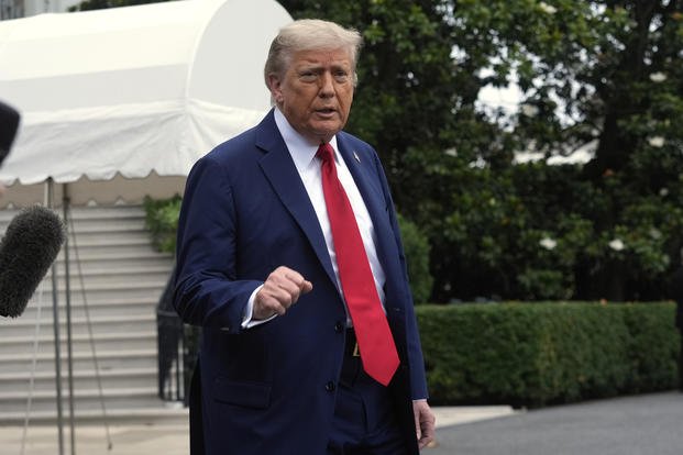 President Donald Trump walks to board Marine One after speaking with reporters