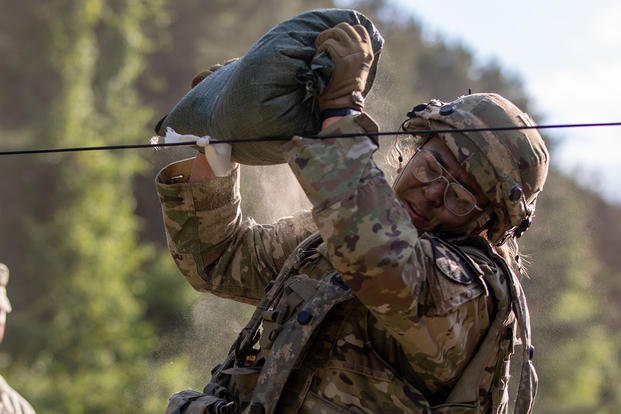 U.S. Army Staff Sgt. Alissa Platukis performs the sandbag throw event during the 8th Army Best Squad Competition at Rodriguez Live Fire Complex, South Korea.