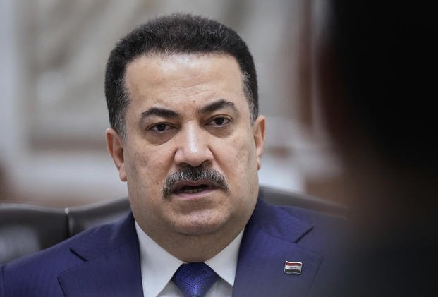 Iraq's Prime Minister Mohammed al-Sudani speaks during an interview with The Associated Press in Baghdad