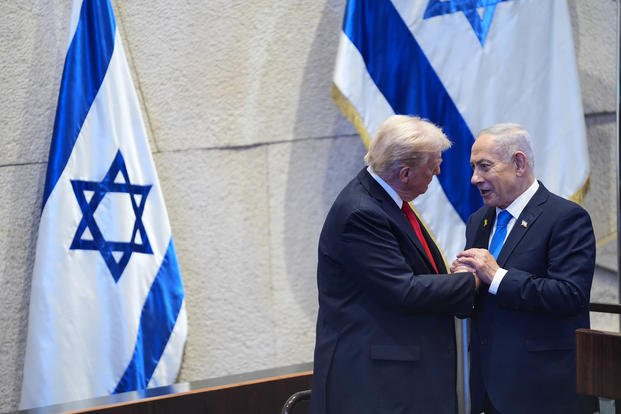President Donald Trump talks with Israel's Prime Minister Benjamin Netanyahu at the Knesset, Israel's parliament