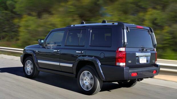 2006-2010 Jeep Commander Black Rear Angled View Driving