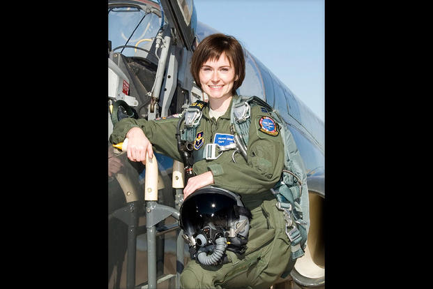 Maj. Devon Meister with her aircraft