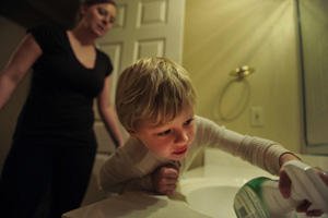 Heather Drain and son cleaning the sink.