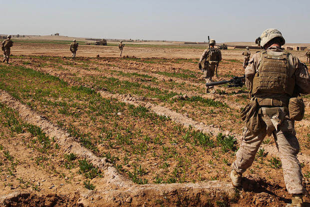 A team of infantry Marines with 3rd Platoon, Charlie Company, 1st Battalion, 9th Marine Regiment, crosses a field during a security patrol in Helmand province, Afghanistan, in 2014. Cpl. Cody Haas/Marine Corps