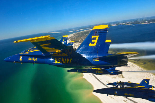 Pilots of the U.S. Navy’s Blue Angels fly in a delta formation during a training flight over the beaches of Pensacola, Fla., on Oct. 23, 2013. (DoD photo by Petty Officer 1st Class Terrence Siren, U.S. Navy)