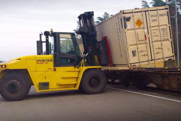 Werner Staab, a heavy equipment operator with the Theater Logistics Support Center-Europe's ammunition center, uses a forklift to offload cargo containers full of ammunition from a train. (U.S. Army photo by James Grell)