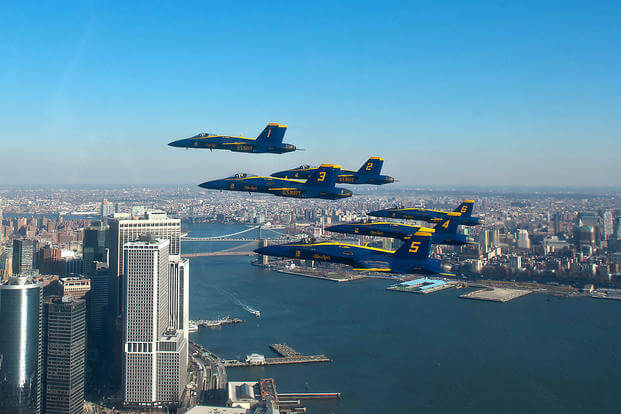 The U.S. Navy Flight Demonstration Squadron, the Blue Angels, pilots fly in the world-renowned Delta Formation past the New York skyline, Dec. 13, 2013. (U.S. Navy photo/Mass Communication Specialist 1st Class Terrence Siren)